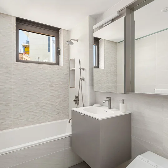Bathrooms are equipped with heated floors, rain shower head system, and stainless steel plumbing. 
