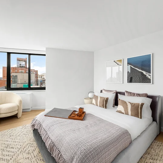 Unit contains white oak bleached engineered wide plank wood flooring, motorized window shades, central air HVAC units, keyless door entry, and custom 8 ft. high solid core interior doors.