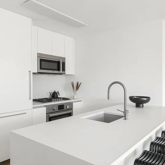 The sleek open kitchen features Scavollini Cabinetry, integrated paneled appliances, Bosch appliances, a silgranit sink, quartz caesarstone kitchen countertops, and a dishwasher. 